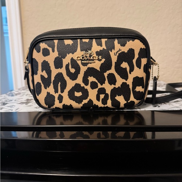 Coach Handbags - Coach Black and Tan Crossbody Bag with Leopard Print